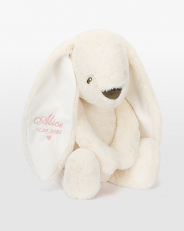 Kermanvärinen kani vaaleanpunaisella brodeerauksella