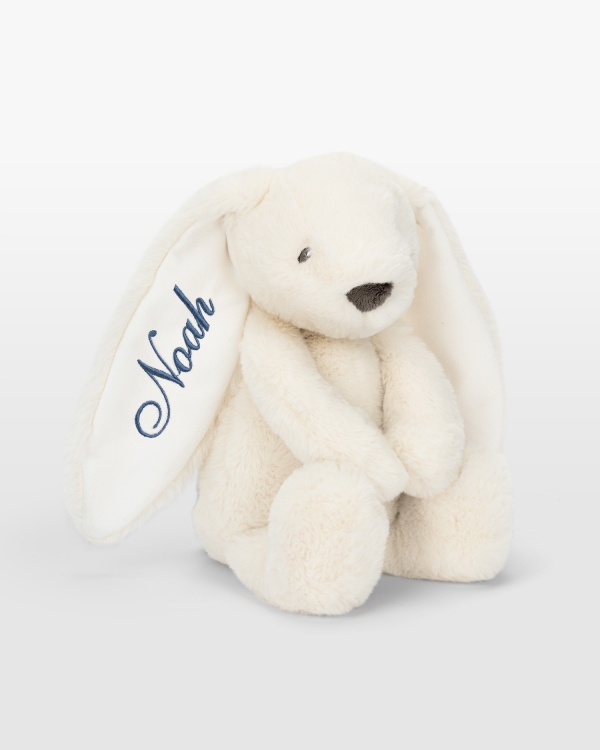 Kermanvärinen kani sinisellä brodeerauksella