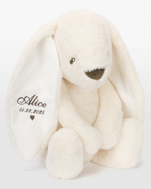 Kermanvärinen kani nimellä ruskealla brodeerauksella