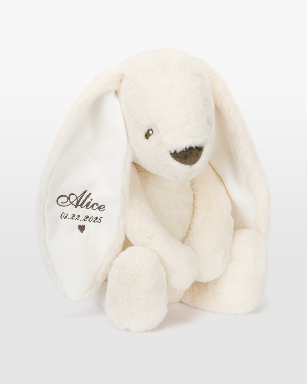 Kermanvärinen kani nimellä ruskealla brodeerauksella